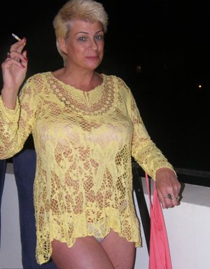 18 year old girl Katie Lewis stands naked after undressing in her bedroom